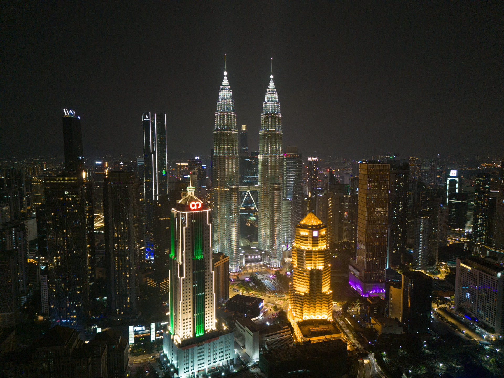 KLCC skyline at night with the Petronas Twin Towers, the trophy address surrounding Divine KLCC