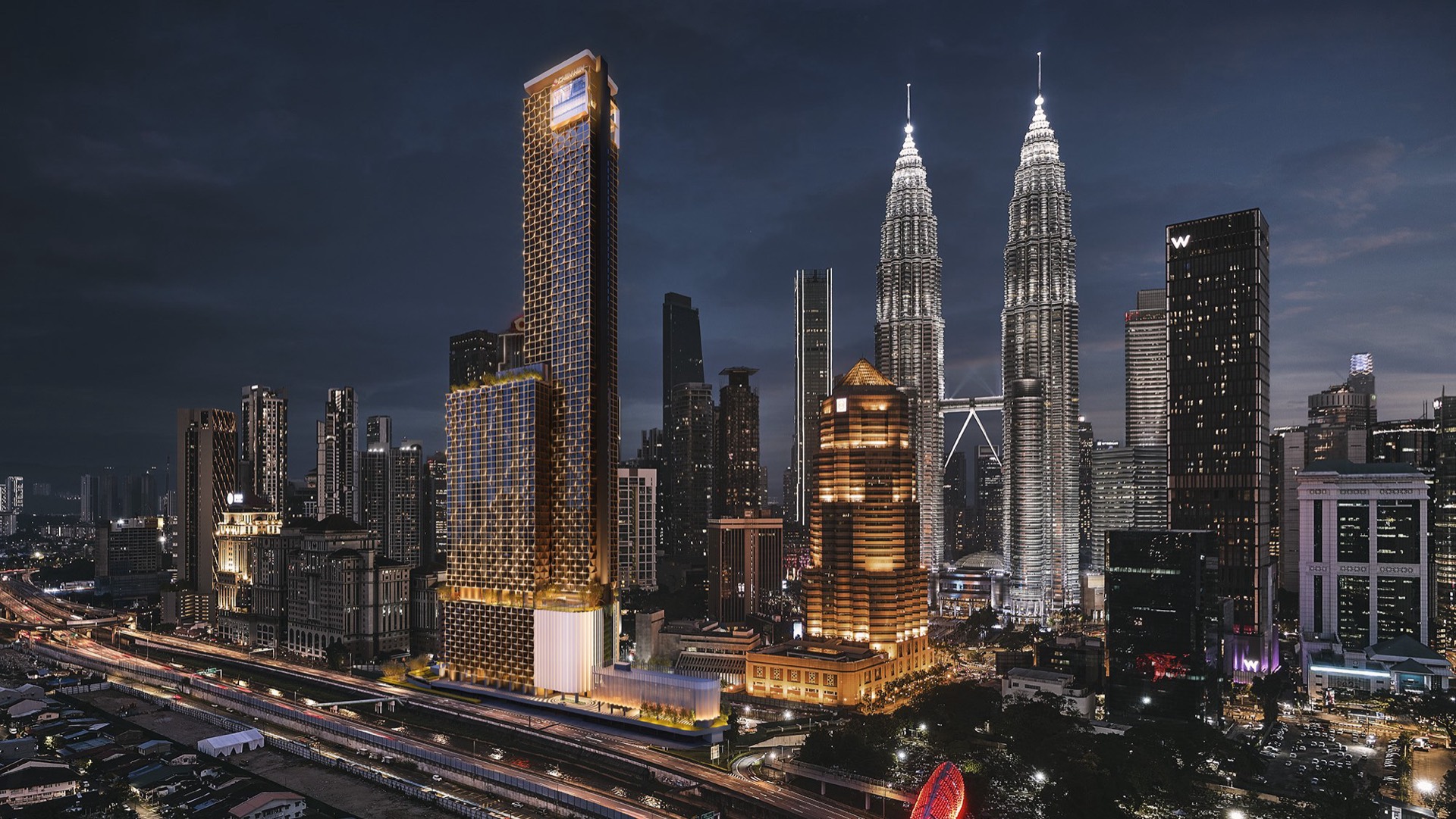 Divine KLCC tower illuminated in the Kuala Lumpur skyline at night, beside the Petronas Twin Towers and the Saloma Link bridge